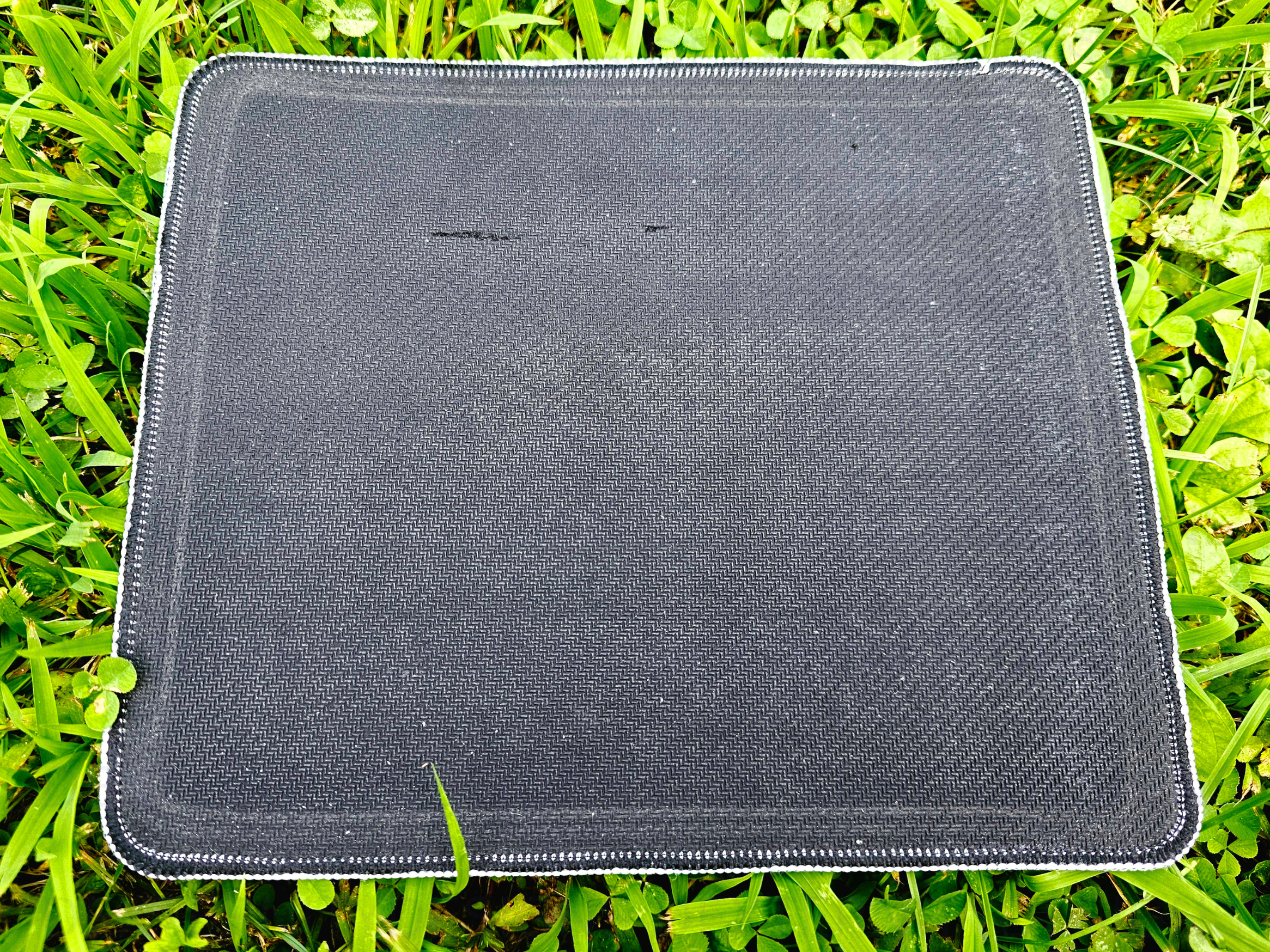 Back of mousepad on grass