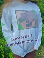 A person wearing a white sweatshirt featuring a groundhog drawing on the chest and leaves on the sleeves. Text on the bottom reads "EXAMPLE OF CUSTOM PRODUCT".