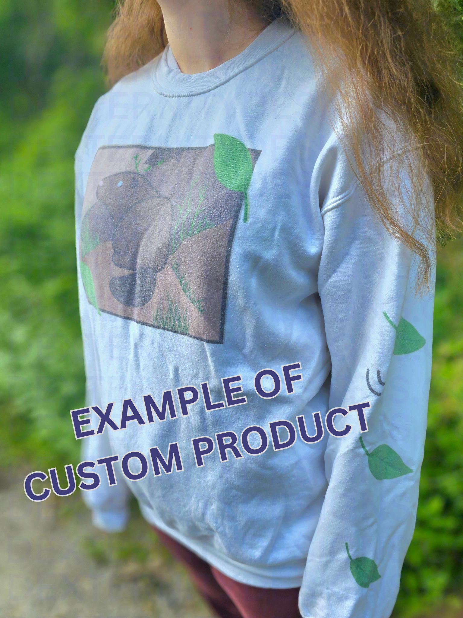 A person wearing a white sweatshirt featuring a groundhog drawing on the chest and leaves on the sleeves. Text on the bottom reads "EXAMPLE OF CUSTOM PRODUCT".